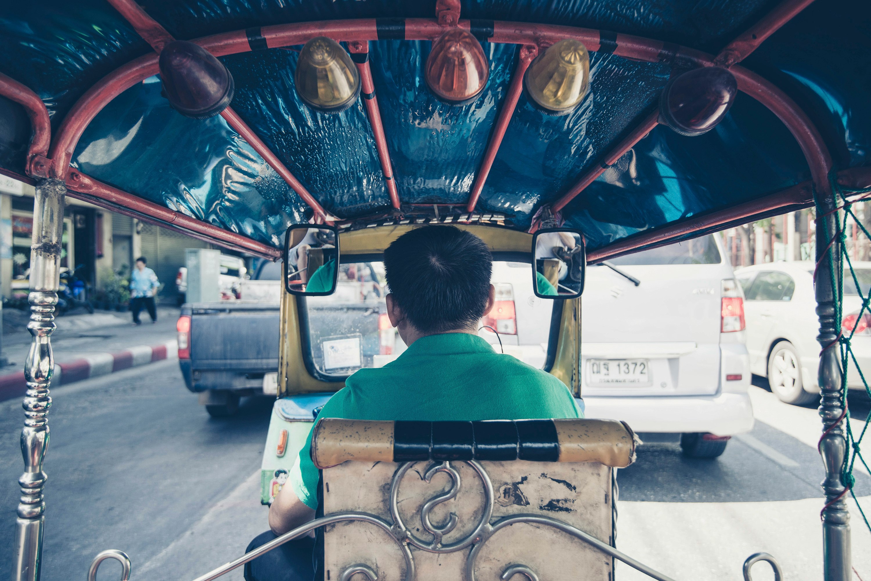 man driving rickshaw